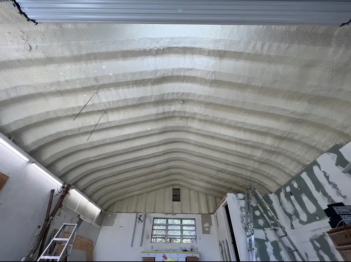Spray polyurethane foam applied to the underside of a metal roof deck in Brookings